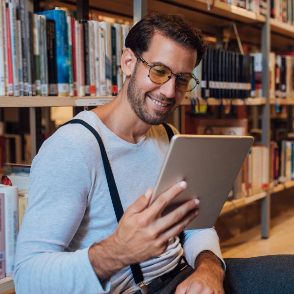 man-reading-on-a-tablet